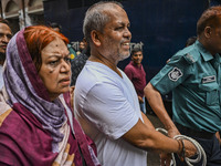 Police are taking protesters to the court after arresting them in Dhaka, Bangladesh, on July 26, 2024. The number of arrests in days of viol...