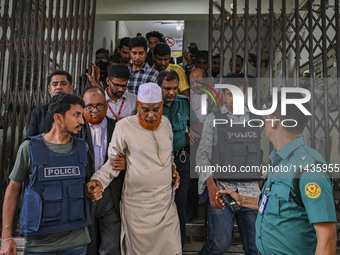 Police are taking protesters to the jail after their court hearing in Dhaka, Bangladesh, on July 26, 2024. The number of arrests in days of...