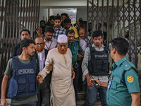 Police are taking protesters to the jail after their court hearing in Dhaka, Bangladesh, on July 26, 2024. The number of arrests in days of...