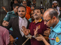 Police are taking protesters to the jail after their court hearing in Dhaka, Bangladesh, on July 26, 2024. The number of arrests in days of...