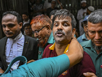 Police are taking protesters to the jail after their court hearing in Dhaka, Bangladesh, on July 26, 2024. The number of arrests in days of...