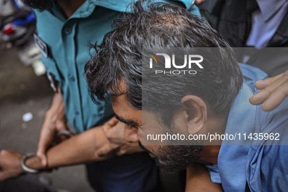 Arson is happening at Setu Bhaban, and Ex-DUCSU VP Nur is being sent to jail after remand in Dhaka, Bangladesh, on July 26, 2024. The number...