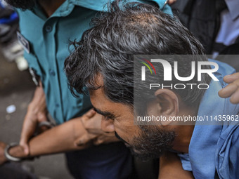 Arson is happening at Setu Bhaban, and Ex-DUCSU VP Nur is being sent to jail after remand in Dhaka, Bangladesh, on July 26, 2024. The number...