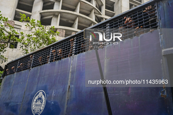 A police van is transporting protesters to the jail after their court hearing in Dhaka, Bangladesh, on July 26, 2024. The number of arrests...