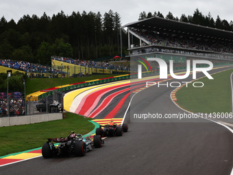 Max Verstappen of Red Bull Racing and Lewis Hamilton of Mercedes during second practice ahead of the Formula 1 Belgian Grand Prix at Spa-Fra...