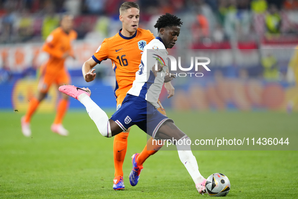 Kobbie Mainoo central midfield of England and Manchester United during the UEFA EURO 2024 semi-final match between Netherlands and England a...