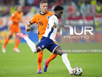 Kobbie Mainoo central midfield of England and Manchester United during the UEFA EURO 2024 semi-final match between Netherlands and England a...