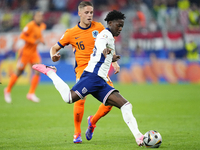 Kobbie Mainoo central midfield of England and Manchester United during the UEFA EURO 2024 semi-final match between Netherlands and England a...