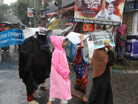 People are being seen during heavy rainfall in Kolkata, India, on July 26, 2024. (