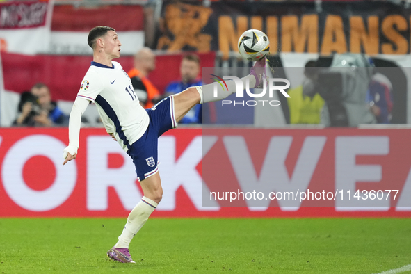 Phil Foden right winger of England and Manchester City controls the ball during the UEFA EURO 2024 semi-final match between Netherlands and...