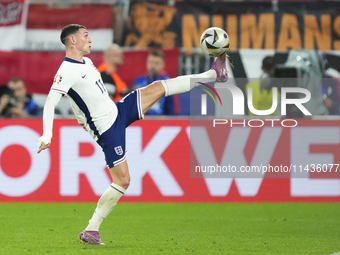 Phil Foden right winger of England and Manchester City controls the ball during the UEFA EURO 2024 semi-final match between Netherlands and...