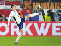 Phil Foden right winger of England and Manchester City controls the ball during the UEFA EURO 2024 semi-final match between Netherlands and...