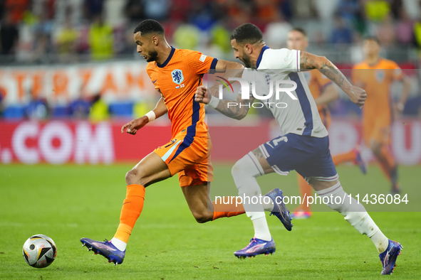 Cody Gakpo left winger of Netherlands and Liverpool FC and Kyle Walker right-back of England and Manchester City compete for the ball during...