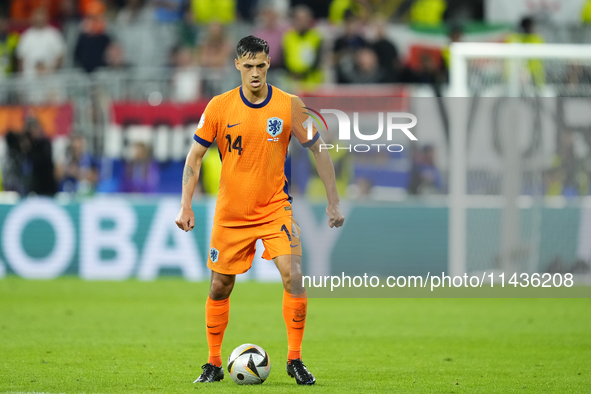 Tijjani Reijnders central midfield of Netherlands and AC Milan during the UEFA EURO 2024 semi-final match between Netherlands and England at...