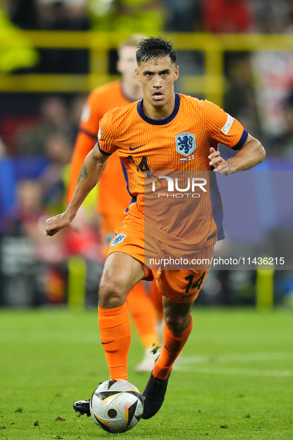 Tijjani Reijnders central midfield of Netherlands and AC Milan during the UEFA EURO 2024 semi-final match between Netherlands and England at...