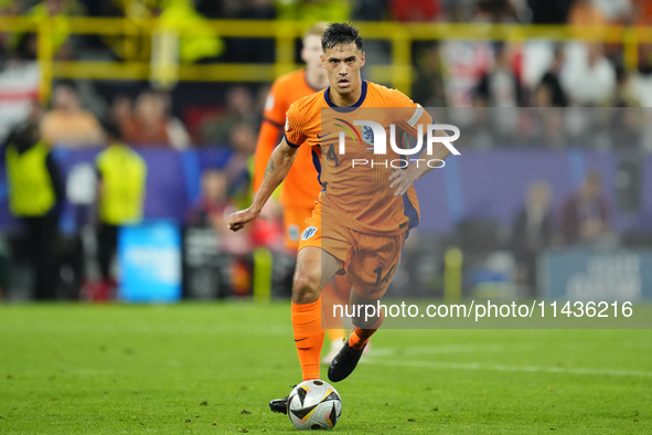 Tijjani Reijnders central midfield of Netherlands and AC Milan during the UEFA EURO 2024 semi-final match between Netherlands and England at...