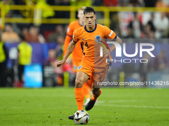 Tijjani Reijnders central midfield of Netherlands and AC Milan during the UEFA EURO 2024 semi-final match between Netherlands and England at...