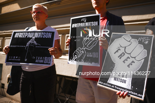 People hold banners during 'Free Paul Watson' demonstration in front of the Consulate General of Denmark in Krakow, Poland on July 26th, 202...