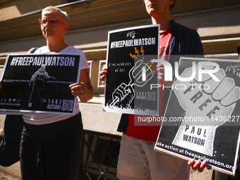 People hold banners during 'Free Paul Watson' demonstration in front of the Consulate General of Denmark in Krakow, Poland on July 26th, 202...