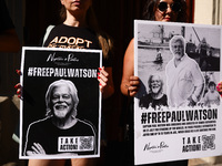 People hold banners during 'Free Paul Watson' demonstration in front of the Consulate General of Denmark in Krakow, Poland on July 26th, 202...