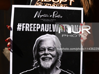 A person holds a banner during 'Free Paul Watson' demonstration in front of the Consulate General of Denmark in Krakow, Poland on July 26th,...