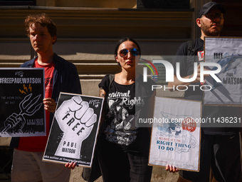 People hold banners during 'Free Paul Watson' demonstration in front of the Consulate General of Denmark in Krakow, Poland on July 26th, 202...