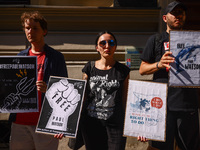 People hold banners during 'Free Paul Watson' demonstration in front of the Consulate General of Denmark in Krakow, Poland on July 26th, 202...