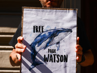 A person holds a banner during 'Free Paul Watson' demonstration in front of the Consulate General of Denmark in Krakow, Poland on July 26th,...