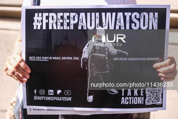 A person holds a banner during 'Free Paul Watson' demonstration in front of the Consulate General of Denmark in Krakow, Poland on July 26th,...