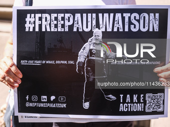 A person holds a banner during 'Free Paul Watson' demonstration in front of the Consulate General of Denmark in Krakow, Poland on July 26th,...