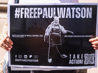 A person holds a banner during 'Free Paul Watson' demonstration in front of the Consulate General of Denmark in Krakow, Poland on July 26th,...