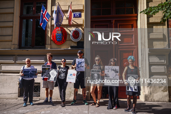 People hold banners during 'Free Paul Watson' demonstration in front of the Consulate General of Denmark in Krakow, Poland on July 26th, 202...