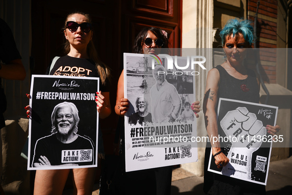 People hold banners during 'Free Paul Watson' demonstration in front of the Consulate General of Denmark in Krakow, Poland on July 26th, 202...