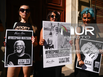 People hold banners during 'Free Paul Watson' demonstration in front of the Consulate General of Denmark in Krakow, Poland on July 26th, 202...