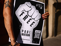 A person holds a banner during 'Free Paul Watson' demonstration in front of the Consulate General of Denmark in Krakow, Poland on July 26th,...