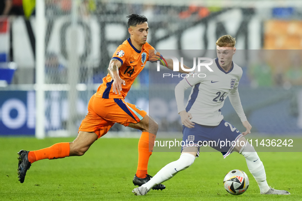 Cole Palmer attacking midfield of England and Chelsea FC and Tijjani Reijnders central midfield of Netherlands and AC Milan compete for the...