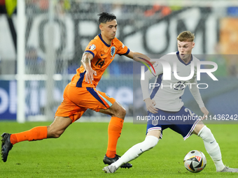 Cole Palmer attacking midfield of England and Chelsea FC and Tijjani Reijnders central midfield of Netherlands and AC Milan compete for the...