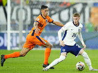 Cole Palmer attacking midfield of England and Chelsea FC and Tijjani Reijnders central midfield of Netherlands and AC Milan compete for the...