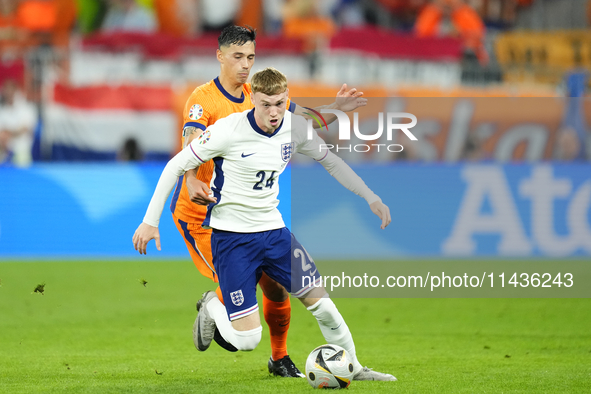 Cole Palmer attacking midfield of England and Chelsea FC and Tijjani Reijnders central midfield of Netherlands and AC Milan compete for the...