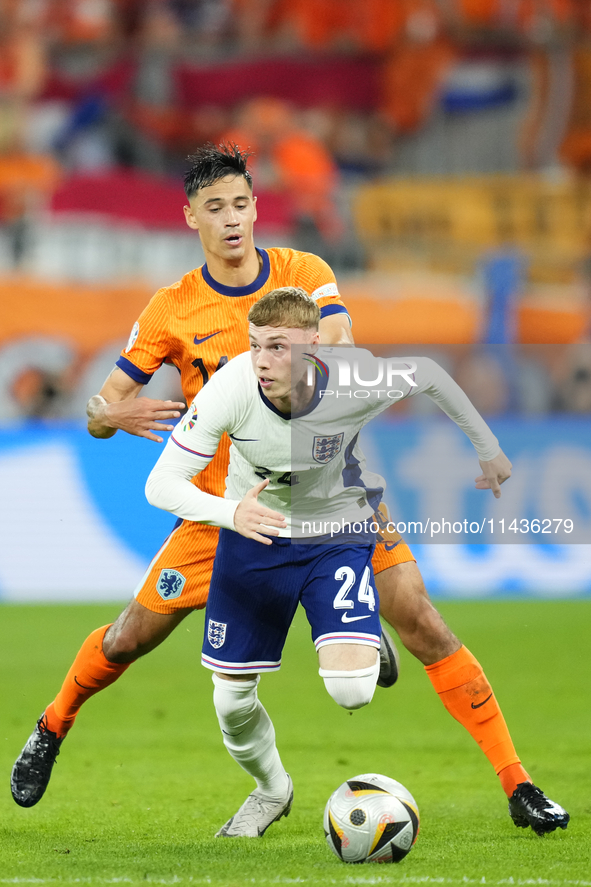 Cole Palmer attacking midfield of England and Chelsea FC and Tijjani Reijnders central midfield of Netherlands and AC Milan compete for the...