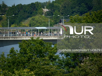 People are seen waiting to cross the border into Russia as seen from  Narva, Estonia on 24 July, 2024. Estonian authorities have closed the...