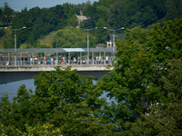 People are seen waiting to cross the border into Russia as seen from  Narva, Estonia on 24 July, 2024. Estonian authorities have closed the...