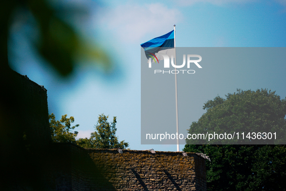 An Estonian flag is seen flying at the Narva Castle in Narva, Estonia on 24 July, 2024. Estonian authorities have closed the bridge that con...