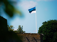 An Estonian flag is seen flying at the Narva Castle in Narva, Estonia on 24 July, 2024. Estonian authorities have closed the bridge that con...