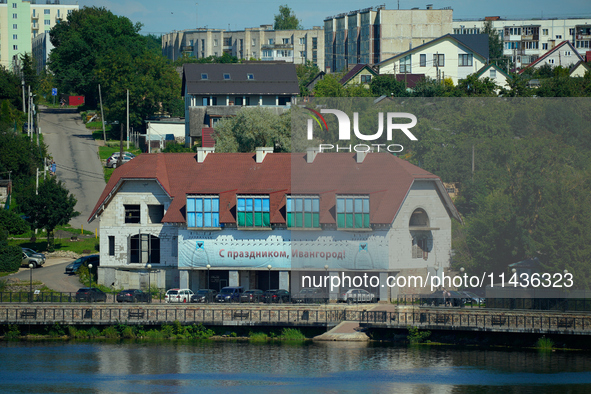 A building with a banner reading ''Happy holidays, Ivangorod'' is seen in Ivangorod, Russia accross the Narva River in Narva, Estonia on 24...