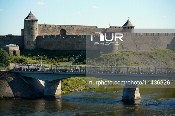 The bridge connecting Estonia with Russia with the Ivangorod Fortress in the background is seen in Narva, Estonia on 24 July, 2024. Estonian...