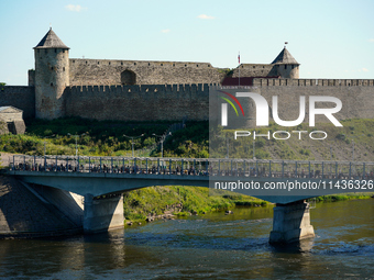 The bridge connecting Estonia with Russia with the Ivangorod Fortress in the background is seen in Narva, Estonia on 24 July, 2024. Estonian...