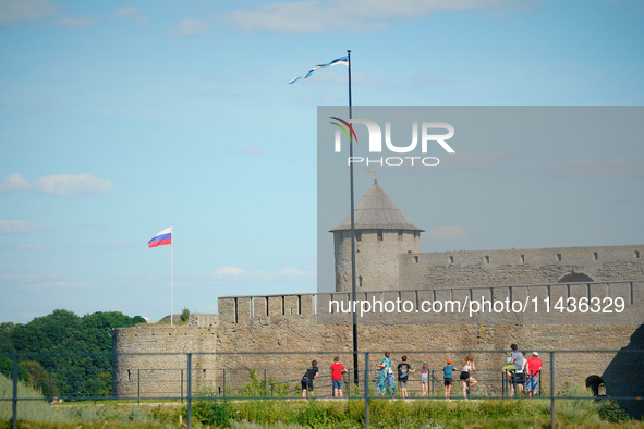 Russian and Estonian flags are seen in Narva, Estonia on 24 July, 2024. Estonian authorities have closed the bridge that connects Russia and...