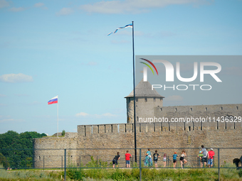 Russian and Estonian flags are seen in Narva, Estonia on 24 July, 2024. Estonian authorities have closed the bridge that connects Russia and...