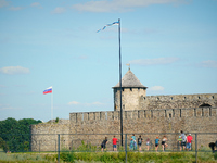 Russian and Estonian flags are seen in Narva, Estonia on 24 July, 2024. Estonian authorities have closed the bridge that connects Russia and...